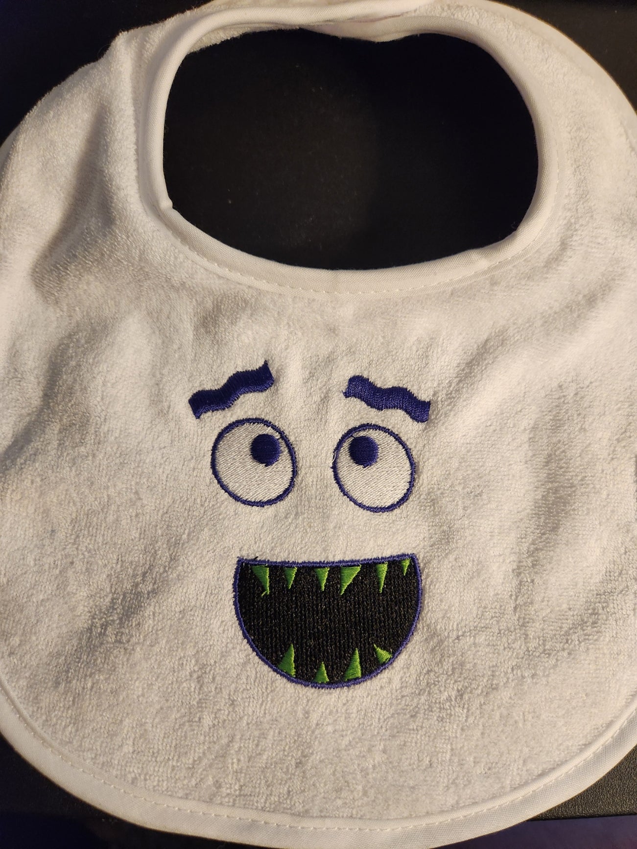 Embroidered Bib with Monster Face
